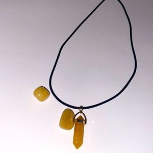A crystal necklace with 2 crystal, and mango wax included.